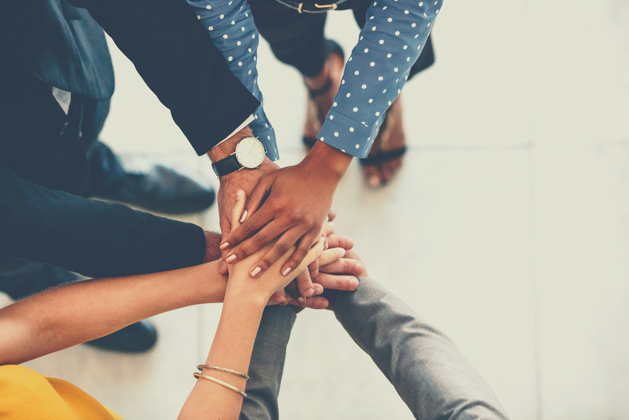 Business Team Hands Stacked Together