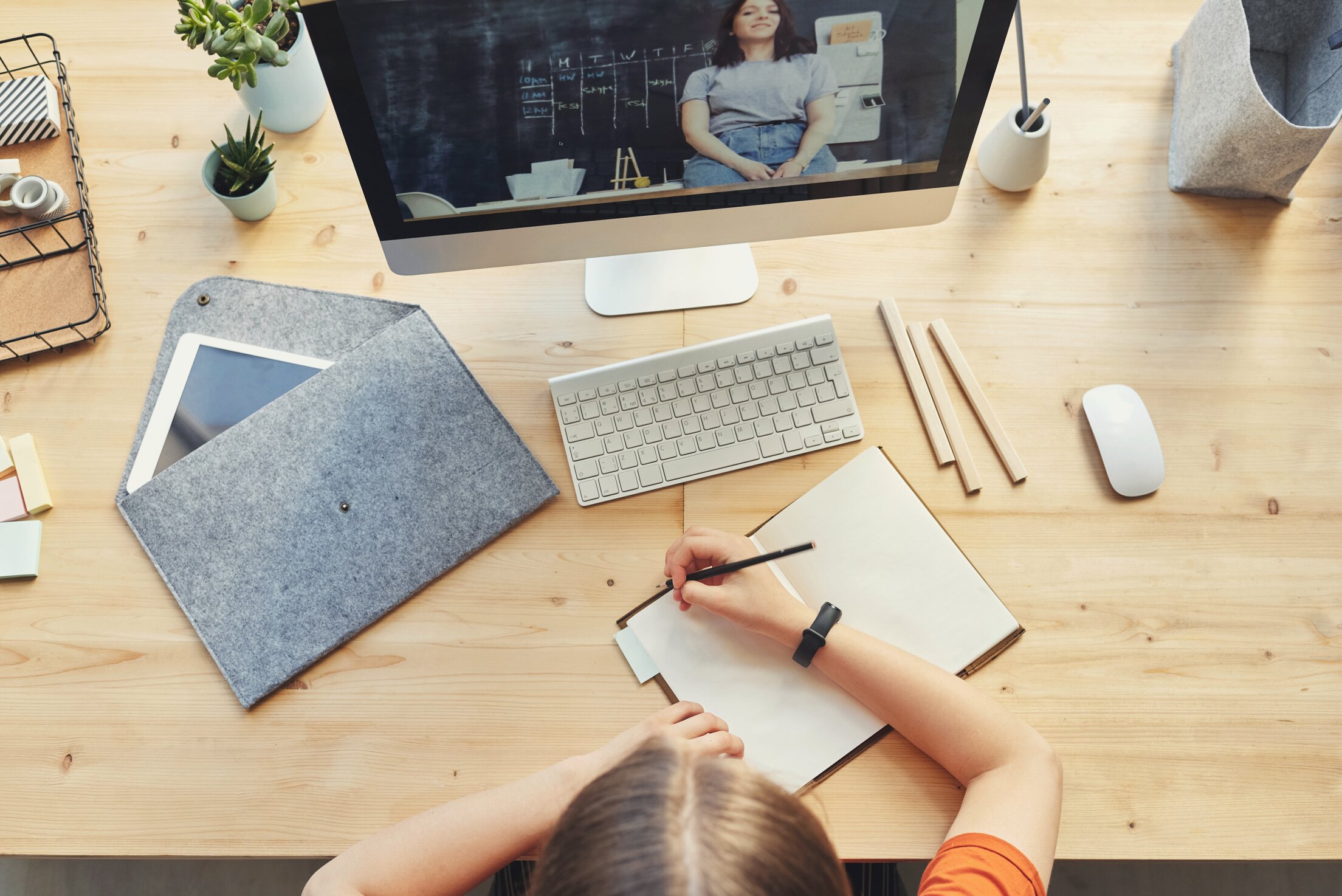 Top View Photo of Person Writing on White Paper